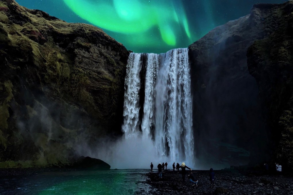 Northern lights dancing above the Skogafoss in South Iceland