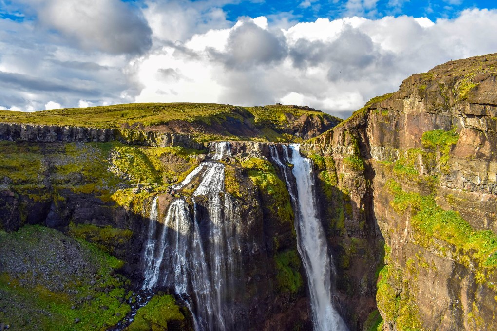 Glymur waterfall is an excellent choice for a summer day hike trip in Iceland