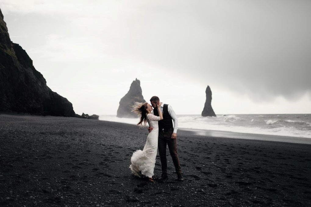 Wedding couple on Reynisfjara beach in Iceland